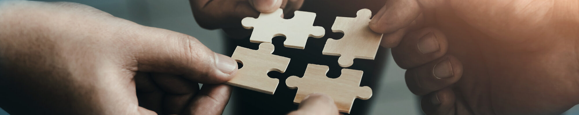 mobile jigsaw puzzle pieces business cooperation concept teamwork and cooperation Businessmen join a jigsaw team, charity, volunteerism, unity, teamwork.